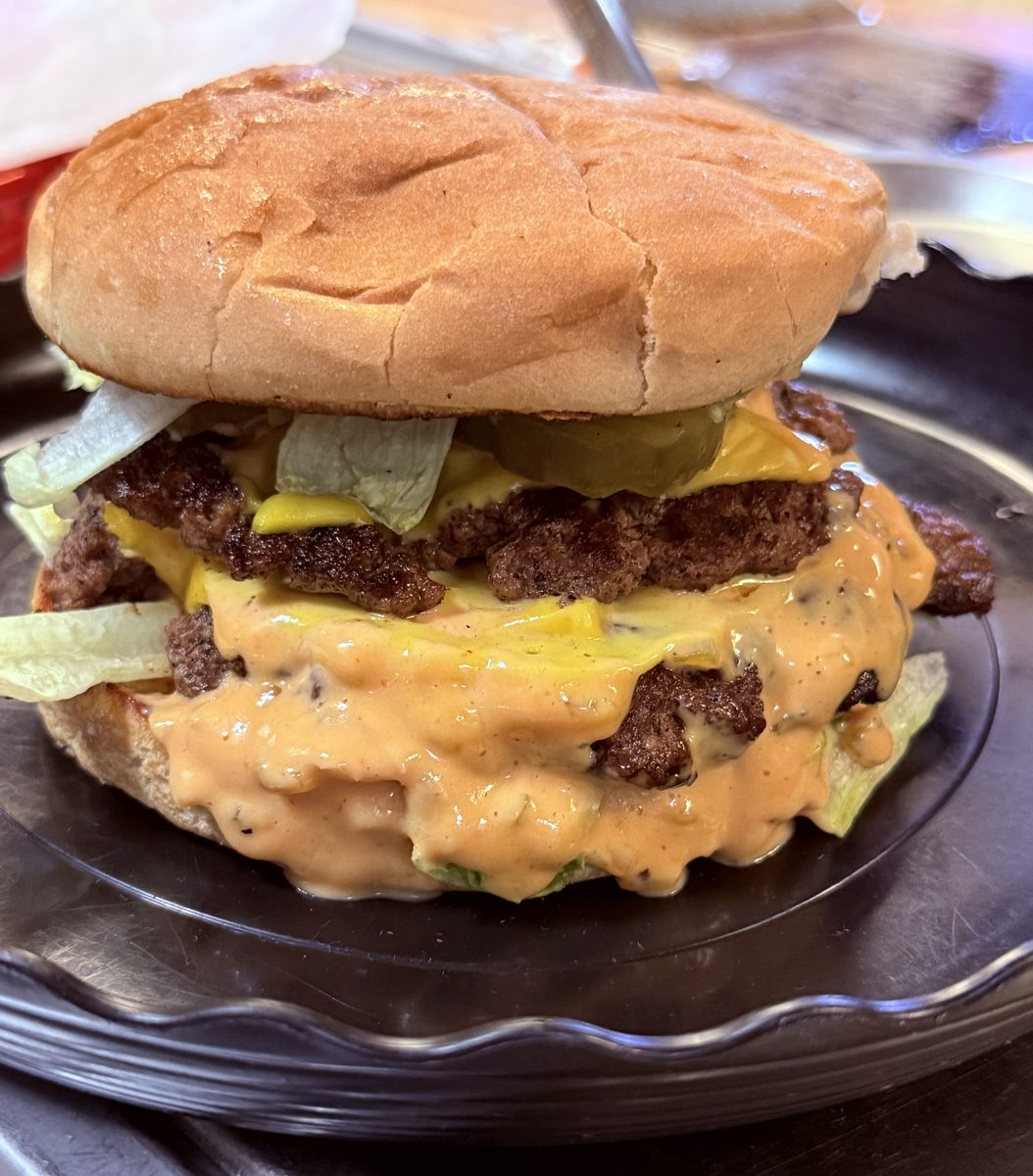 Double smash burger with cheese, lettuce, pickles and house sauce
